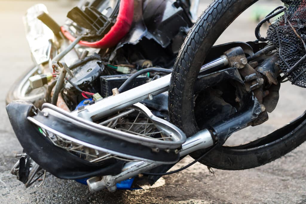 Close-up of a distorted motorcycle wheel of a driver who needs to know how to file a motorcycle accident personal injury claim